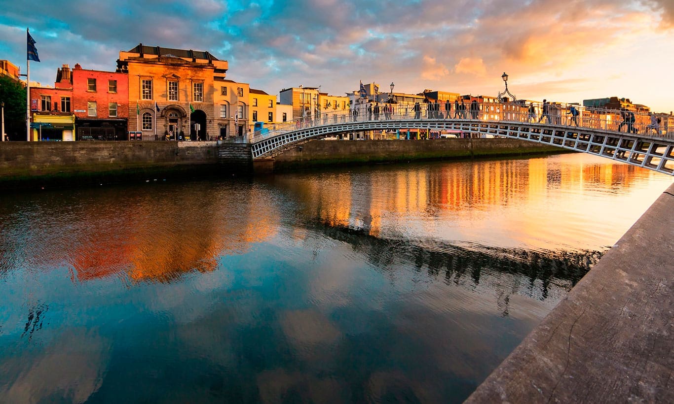 The Ha'penny Bridge over the River Liffey in Dublin at dusk
