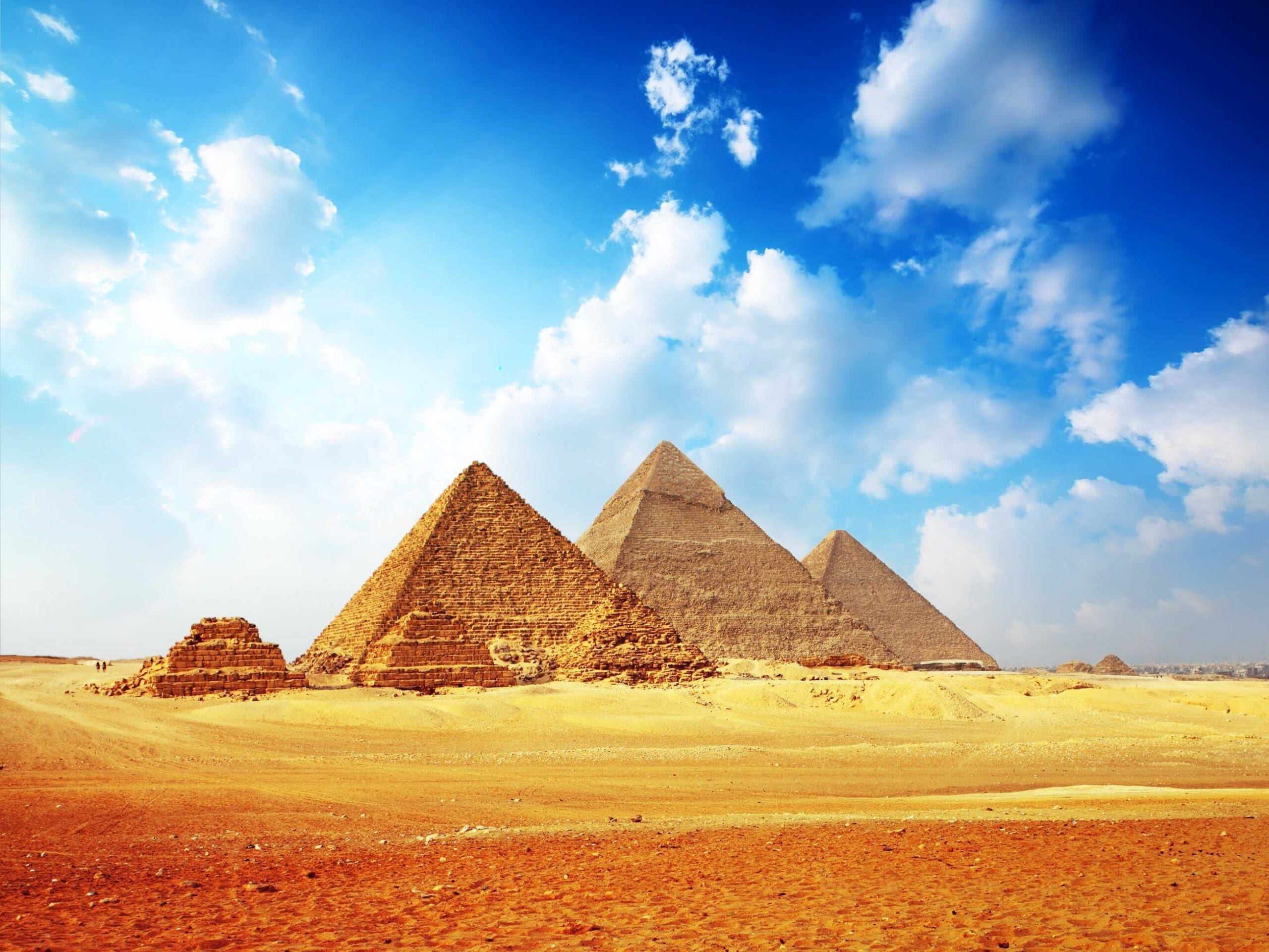 The Pyramids of Giza under a wide sky