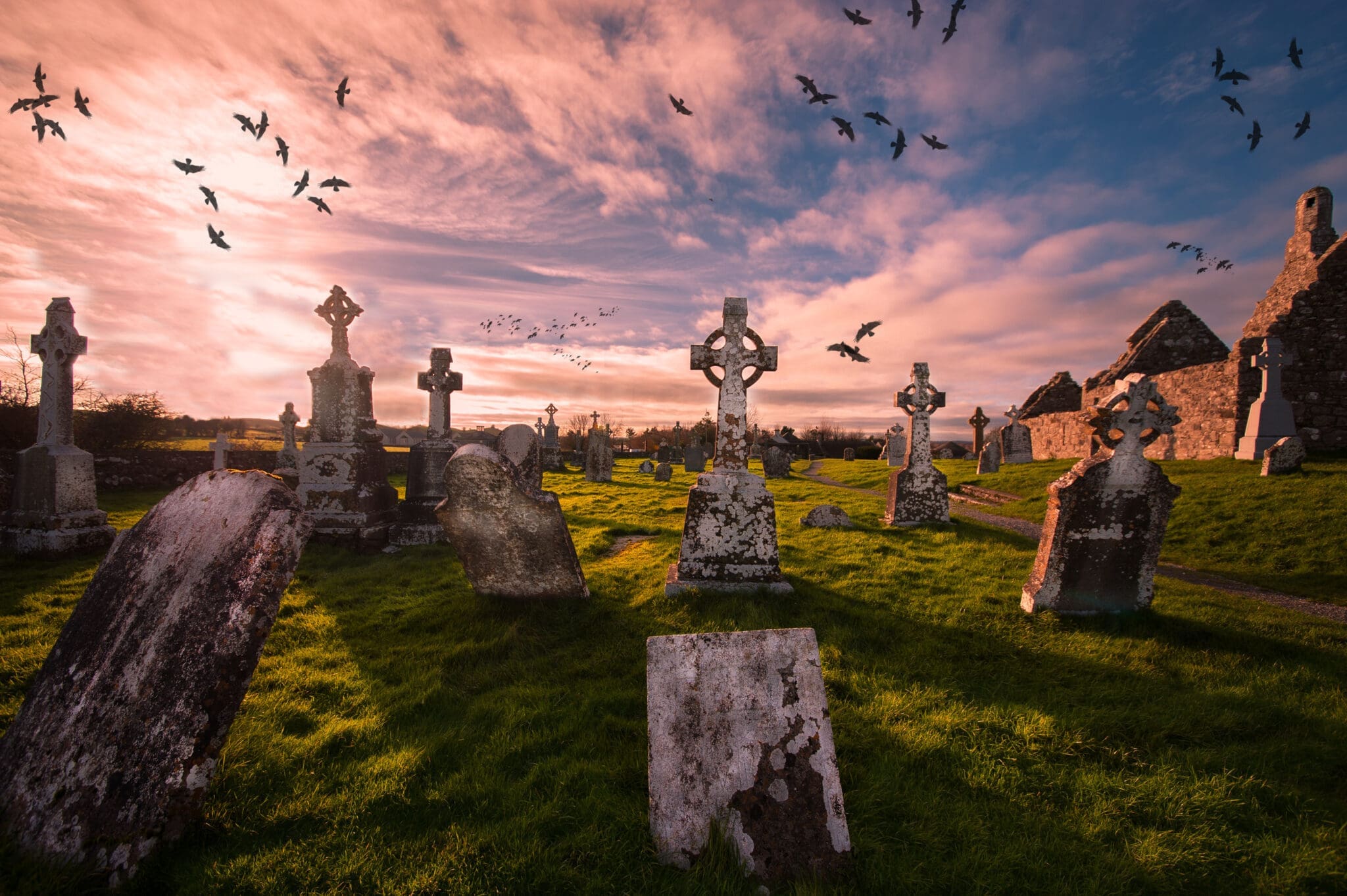 High crosses and ruins in the monastic cemetery at Clonmacnoise, Ireland
