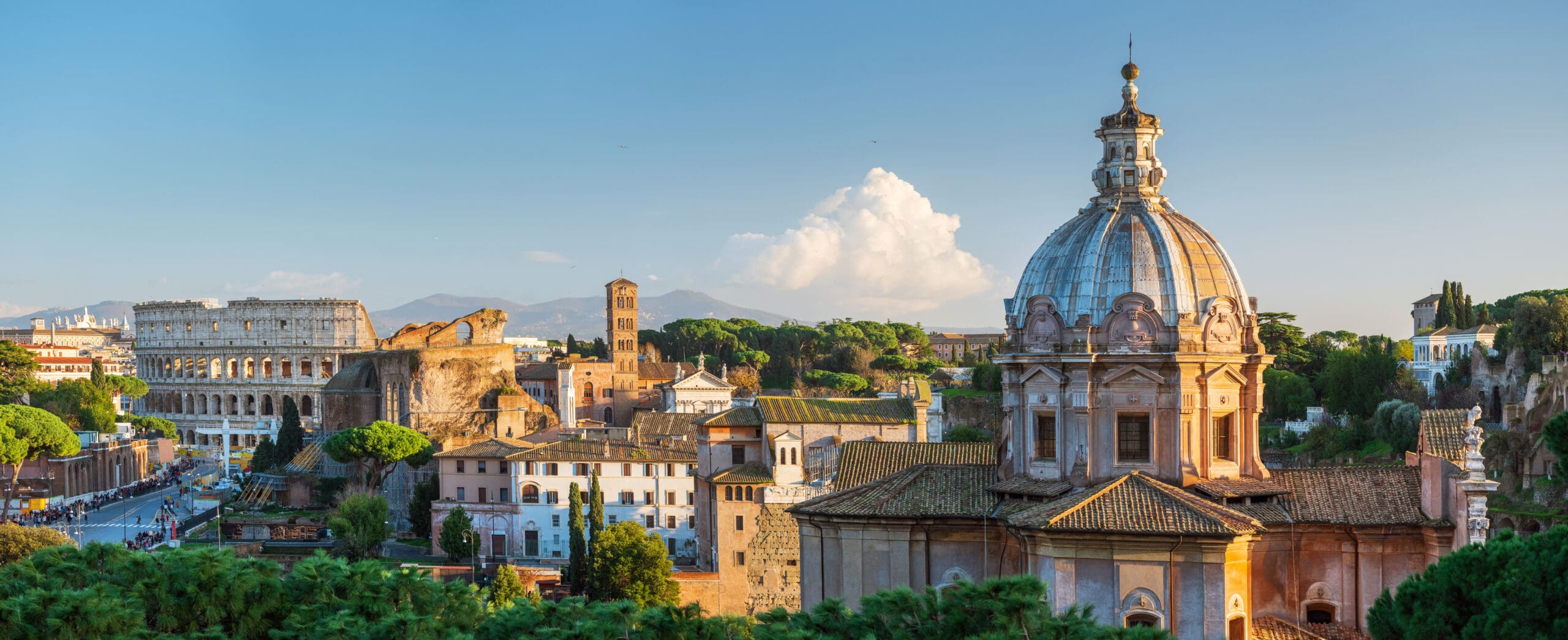 The Roman Forum and the Colosseum seen across the ruins