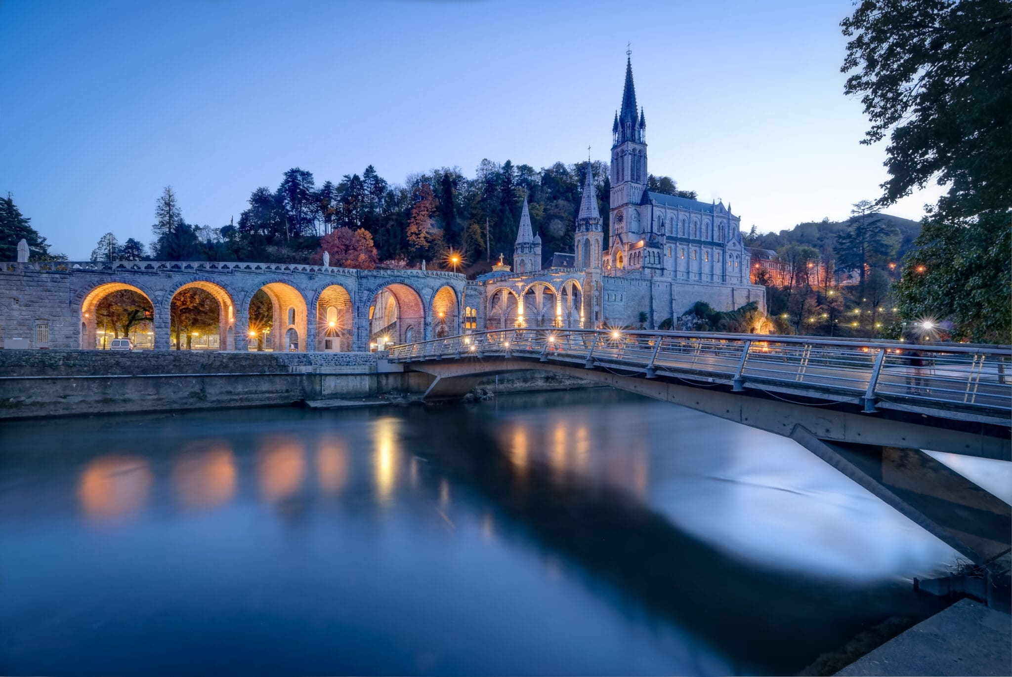 The sanctuary at Lourdes lit at dusk