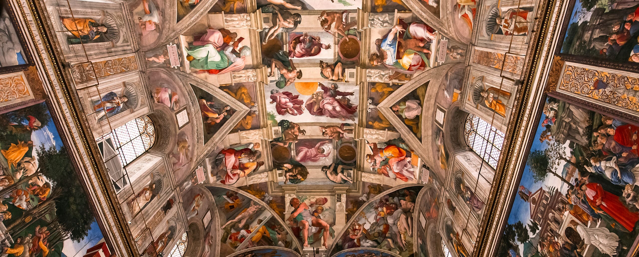 Frescoed vaulting and detail inside the Sistine Chapel