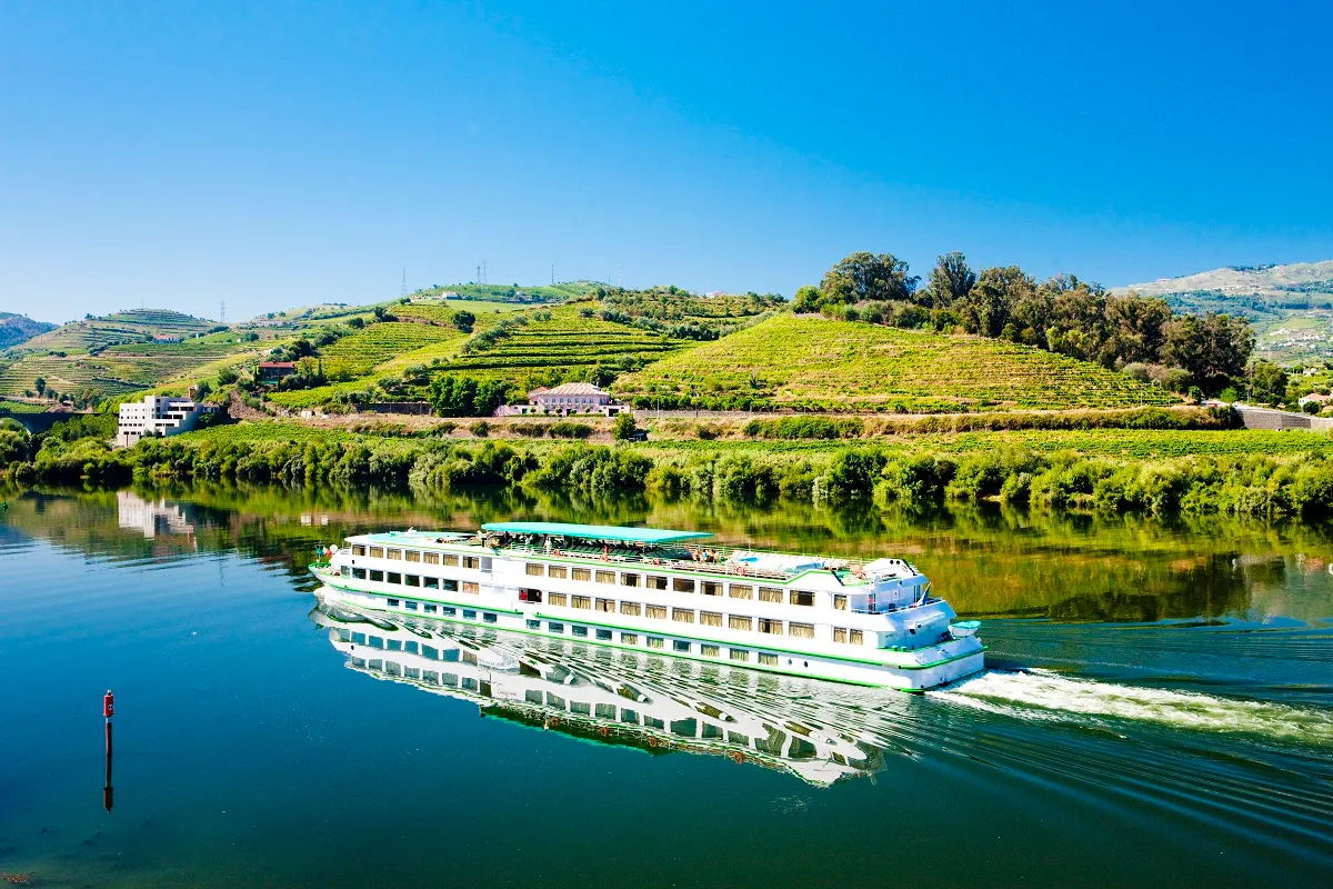 A river ship on the Douro below the terraced vineyards