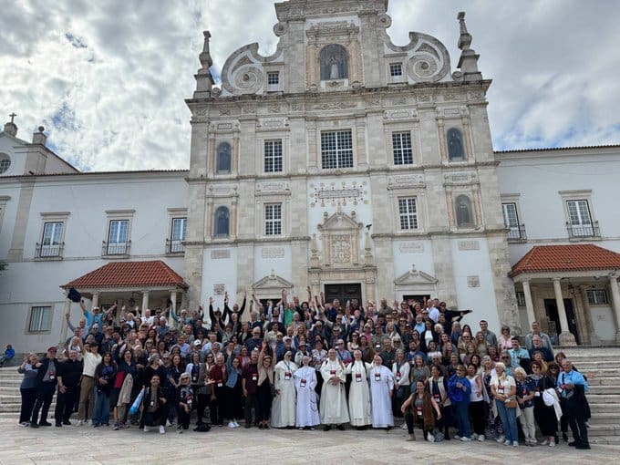 The whole pilgrimage group photographed on the steps of a sanctuary church